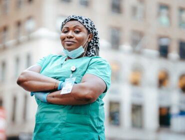 A foreign-educated nurse in scrubs